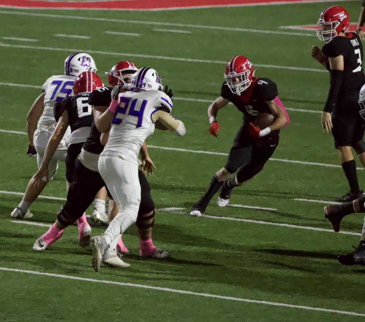 Elgin running back Matt Lund (with ball)